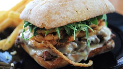 Image for Steak & Cheese Sandwich with Crispy Onions and Arugula-Pesto Mayo