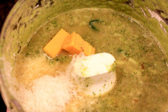 transfer half of your soup mixture to a blender or food processor. add half of both cheeses and blend until smooth. repeat.
