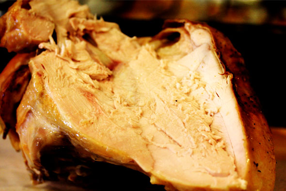 carve one side of the breast meat and serve. but check out how juicy this turkey is. it's not dry at all!