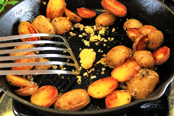 Add the garlic and cook for 1 minute. Toss the potatoes with the shallolts, garlic until evenly mixed. Taste and adjust seasoning if necessary.