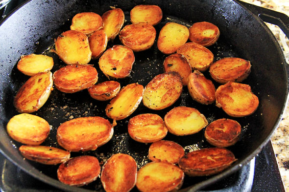 The potatoes are done when the oil is all soaked up and they're beautifully golden brown. Ahhh!