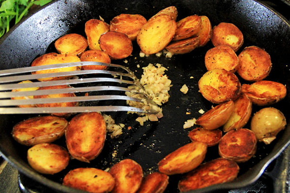 Turn off the heat. Make a well in the center of the skillet, add the shallots and cook for about 3-4 minutes.