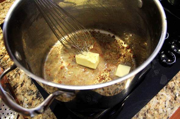 with the heat turned OFF, melt 4 tbsp of unsalted  butter.