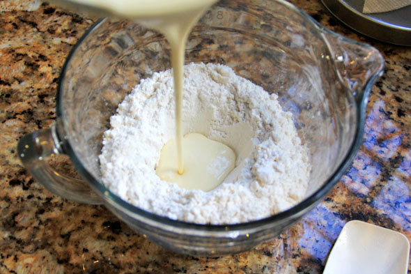 Make a well, and pour the very cold buttermilk mixture into the very cold flour/butter mixture.