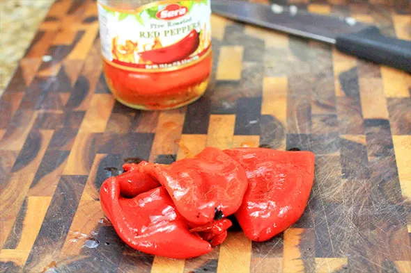 Take 3 roasted red peppers (either homemade or jarred), and chop them up.