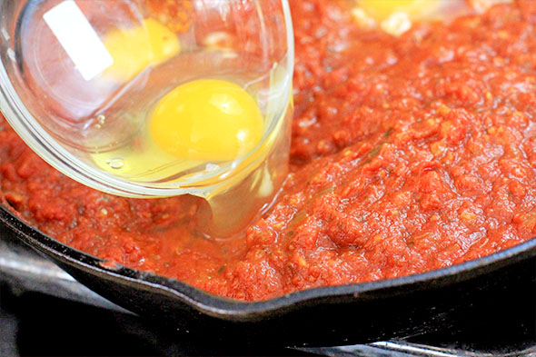 Then gently pour each egg into the wells. 