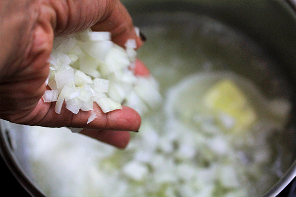 once the butter starts t melt, add the onion.