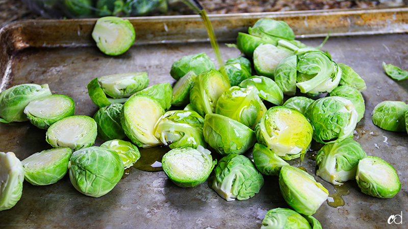 olive oil drizzled on brussels