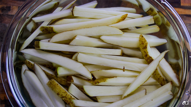 russet potatoes soaking in water