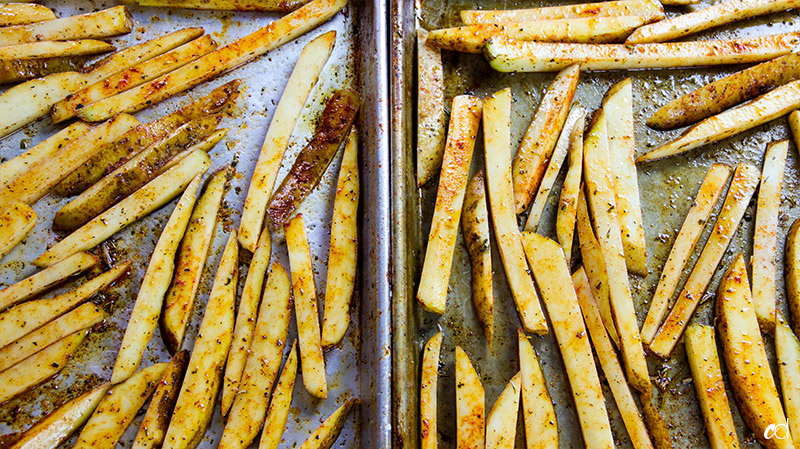 potato fries on baking sheet seasoned and oiled