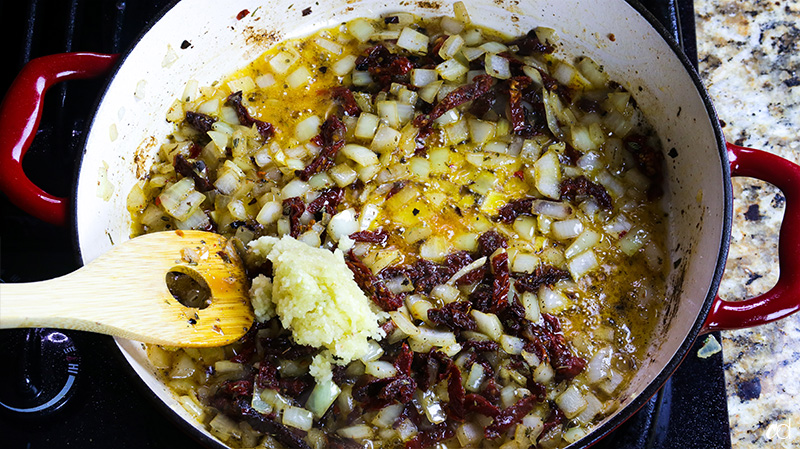 fresh garlic added to sun-dried tomatoes