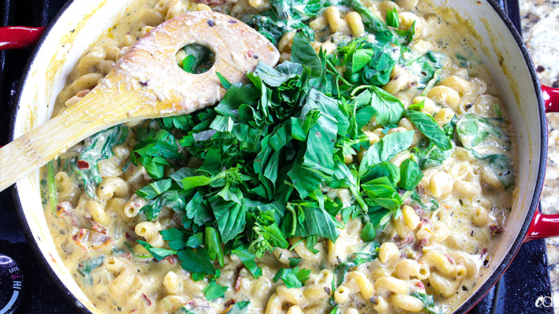 fresh basil and parsley added to pasta