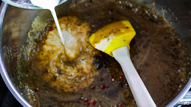 adding cream to savory caramel