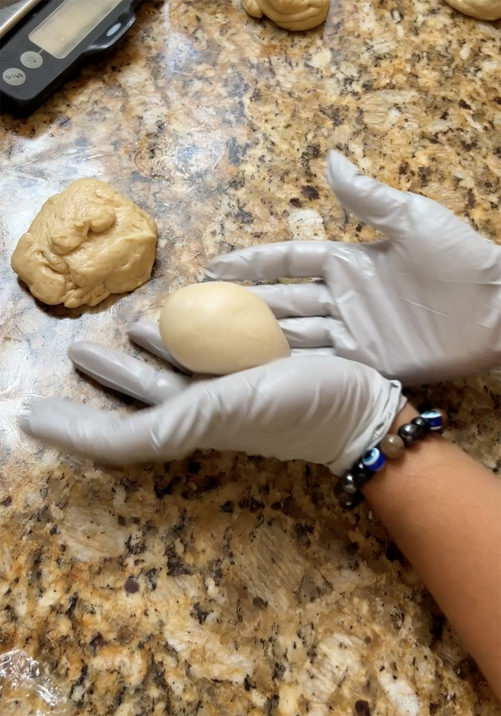 forming portioned dough into balls