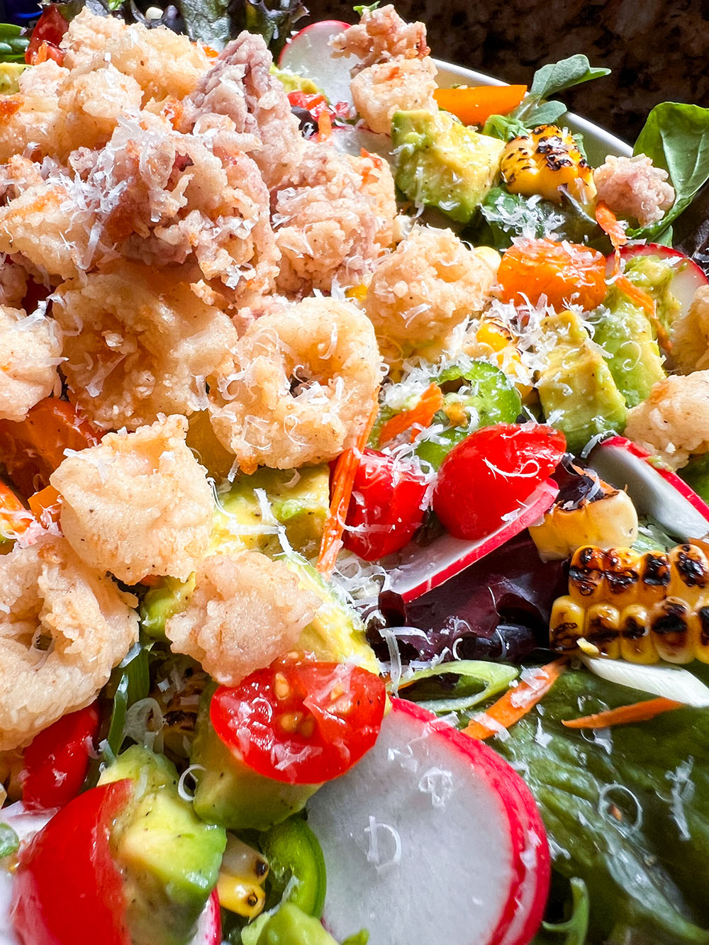Fried Calamari On Top Of Salad