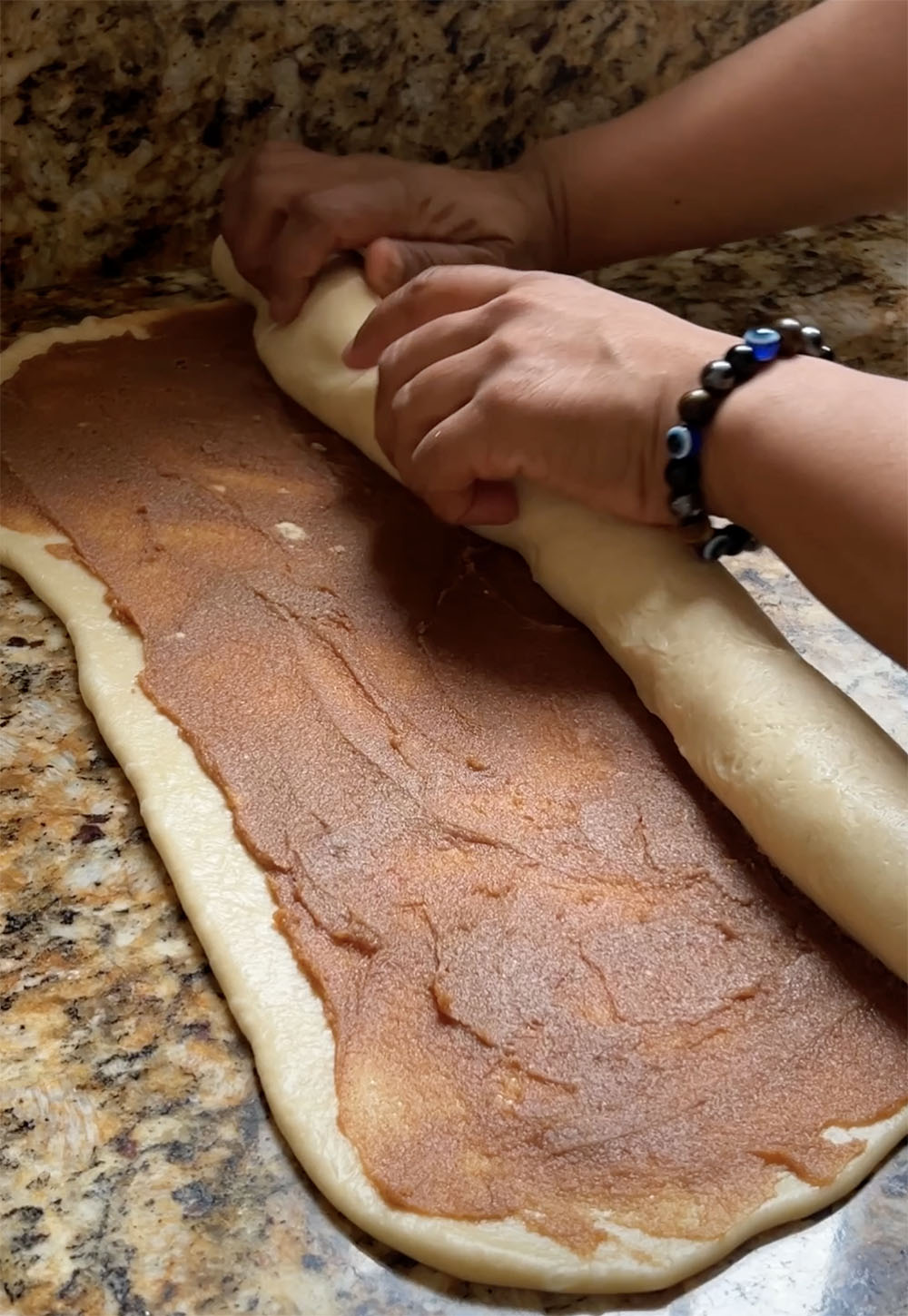 rolling the cinnamon rolls