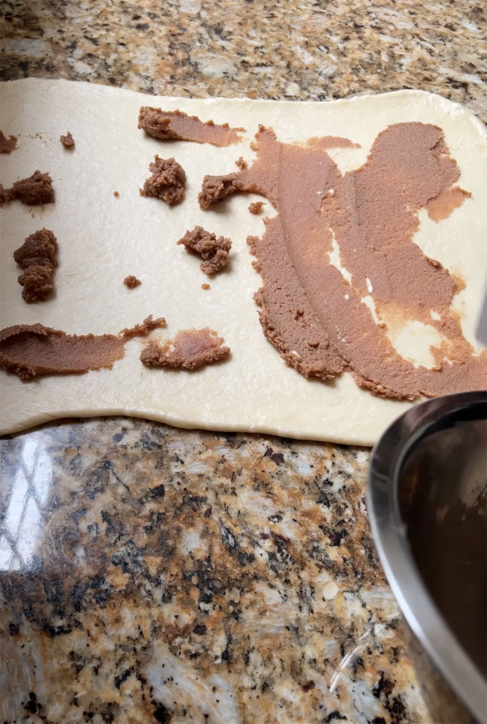 spreading the filling on the dough